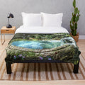 Fantasy plush blanket featuring a whimsical portal and nature elements
