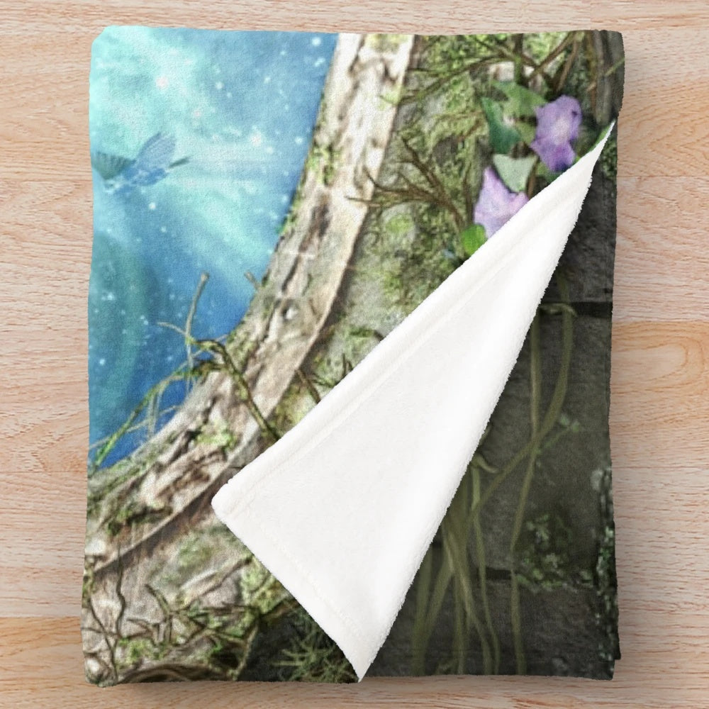 Fantasy plush blanket featuring a whimsical portal and nature elements