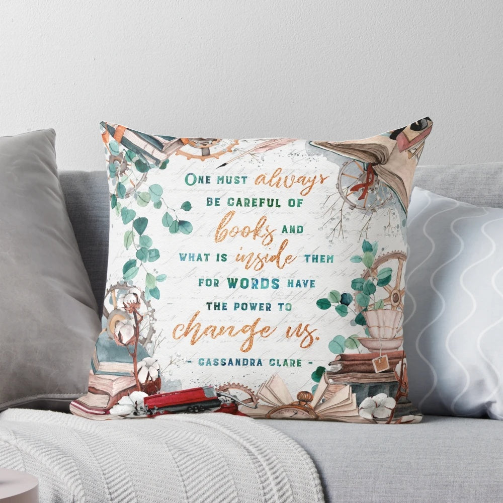 Decorative angel-themed throw pillow with a watercolor book stack and floral clockwork design, perfect for fantasy book lovers.