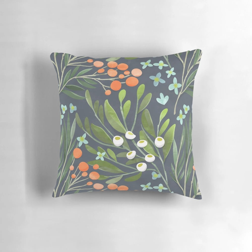 A beautifully designed floral botanical pillow in soothing green, blue, and pink tones.