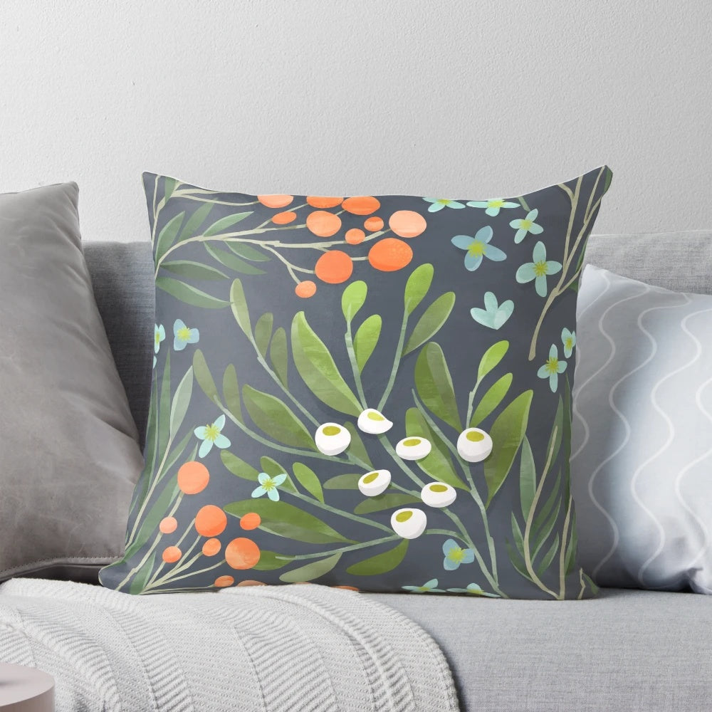 A beautifully designed floral botanical pillow in soothing green, blue, and pink tones.