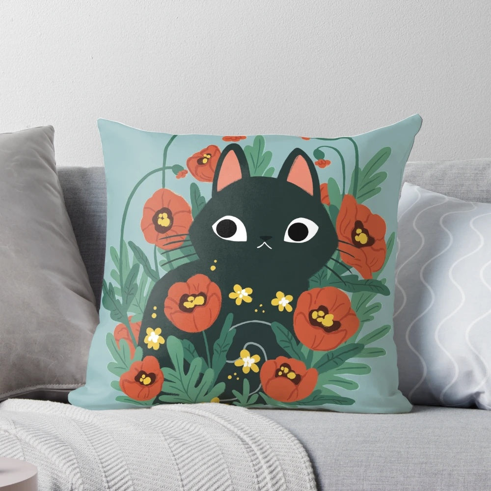 A cozy throw pillow featuring a charming black cat surrounded by vibrant poppy flowers and daisies.