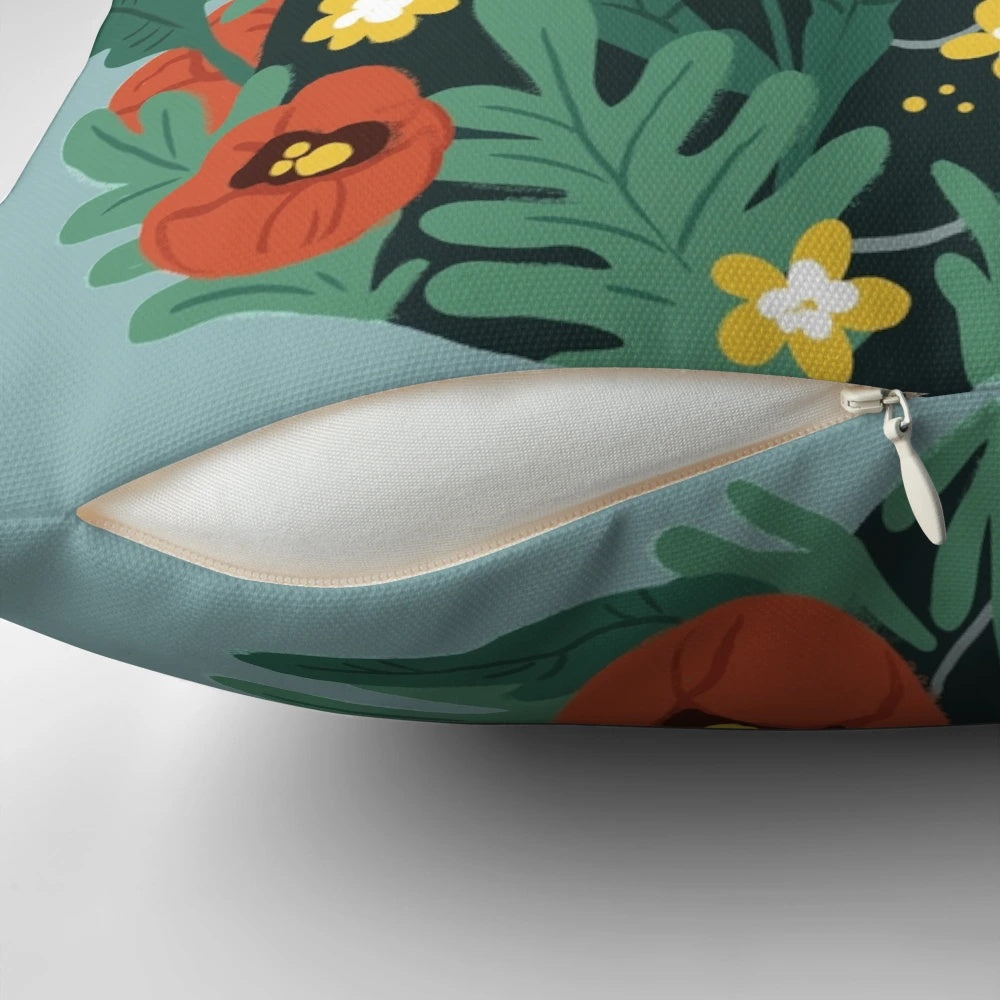 A cozy throw pillow featuring a charming black cat surrounded by vibrant poppy flowers and daisies.