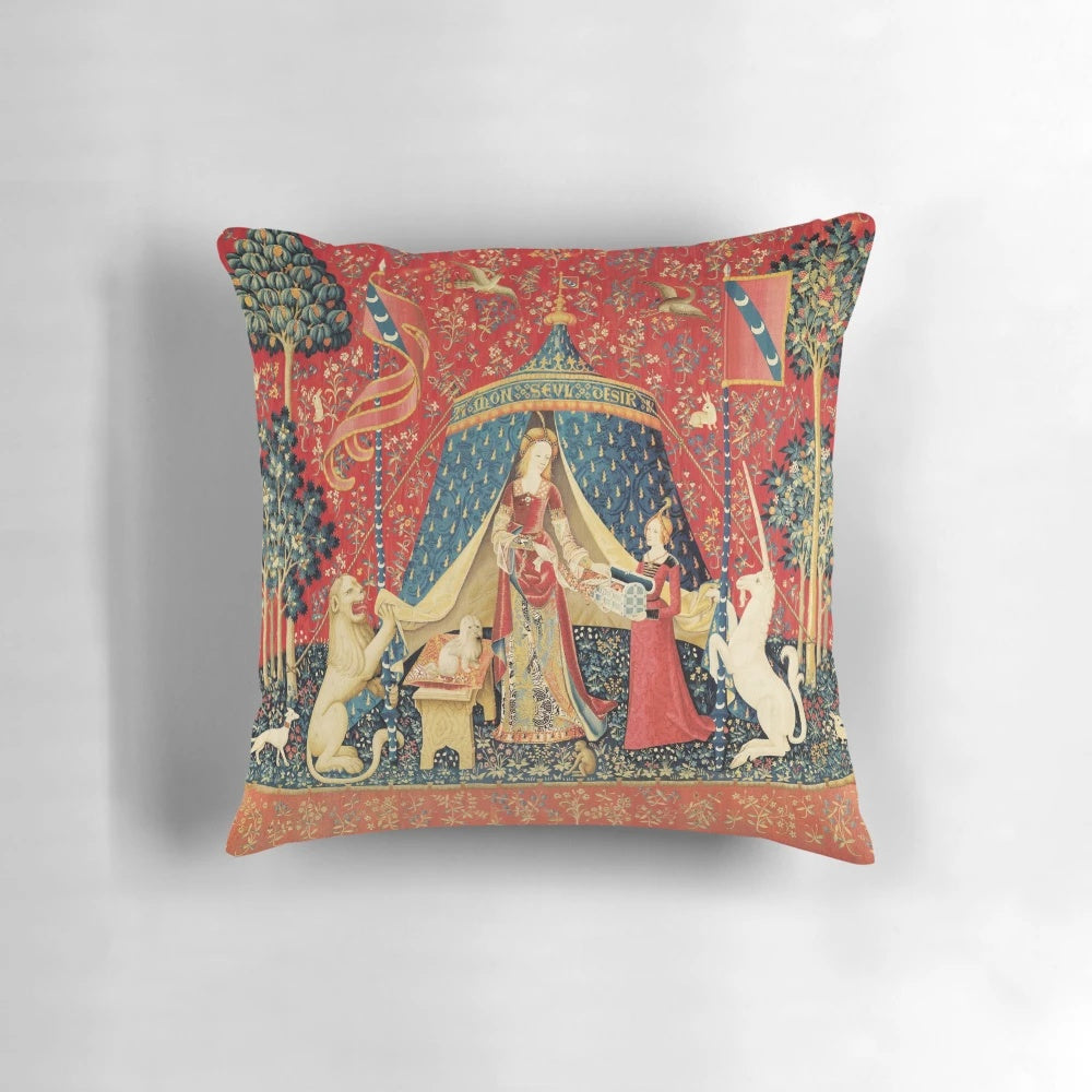Decorative red and green floral tapestry pillow featuring a unicorn and lion in a medieval-inspired fantasy design.