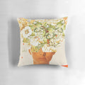 A vibrant, surreal pillow featuring a woman's face adorned with a colorful flower crown design.
