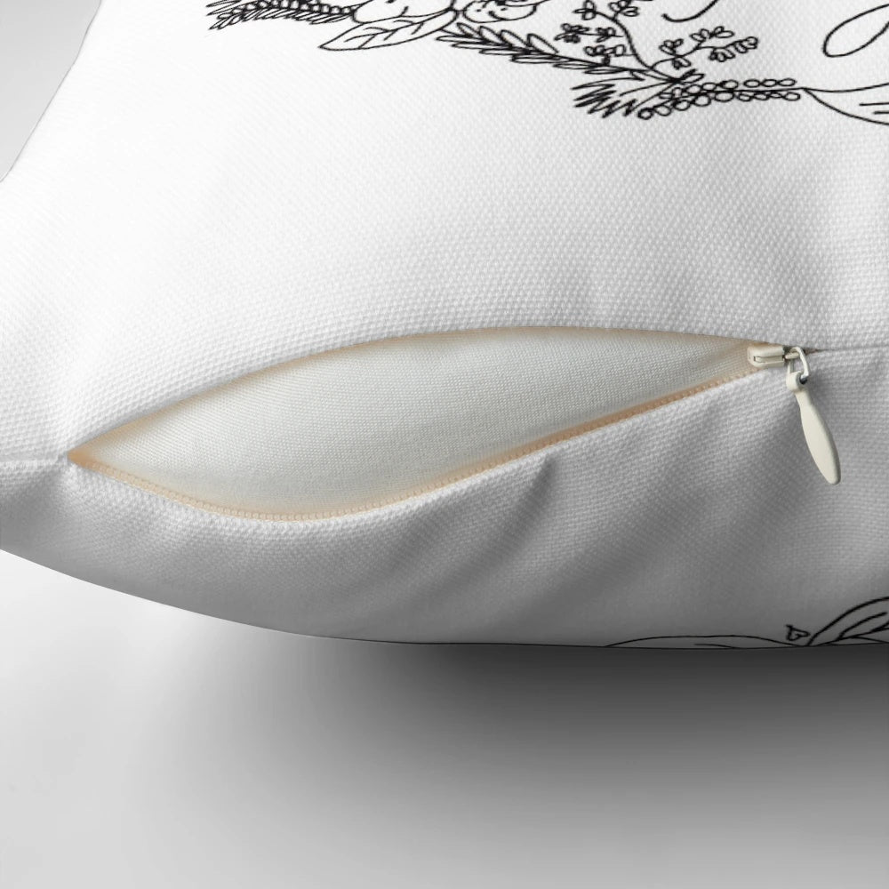 A black and white floral sketch pillow with a quote from the iconic Disney character Peter Pan