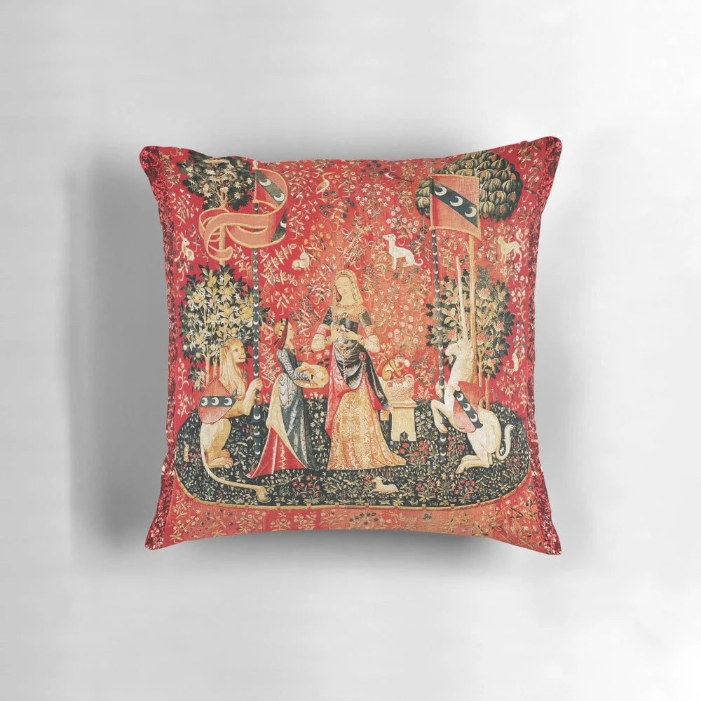 Decorative pillow featuring a medieval-inspired floral tapestry design with fantastical elements.