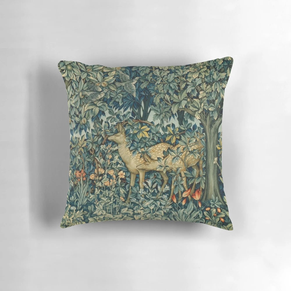 Vibrant green floral tapestry pillow with deer and birds in a serene forest setting