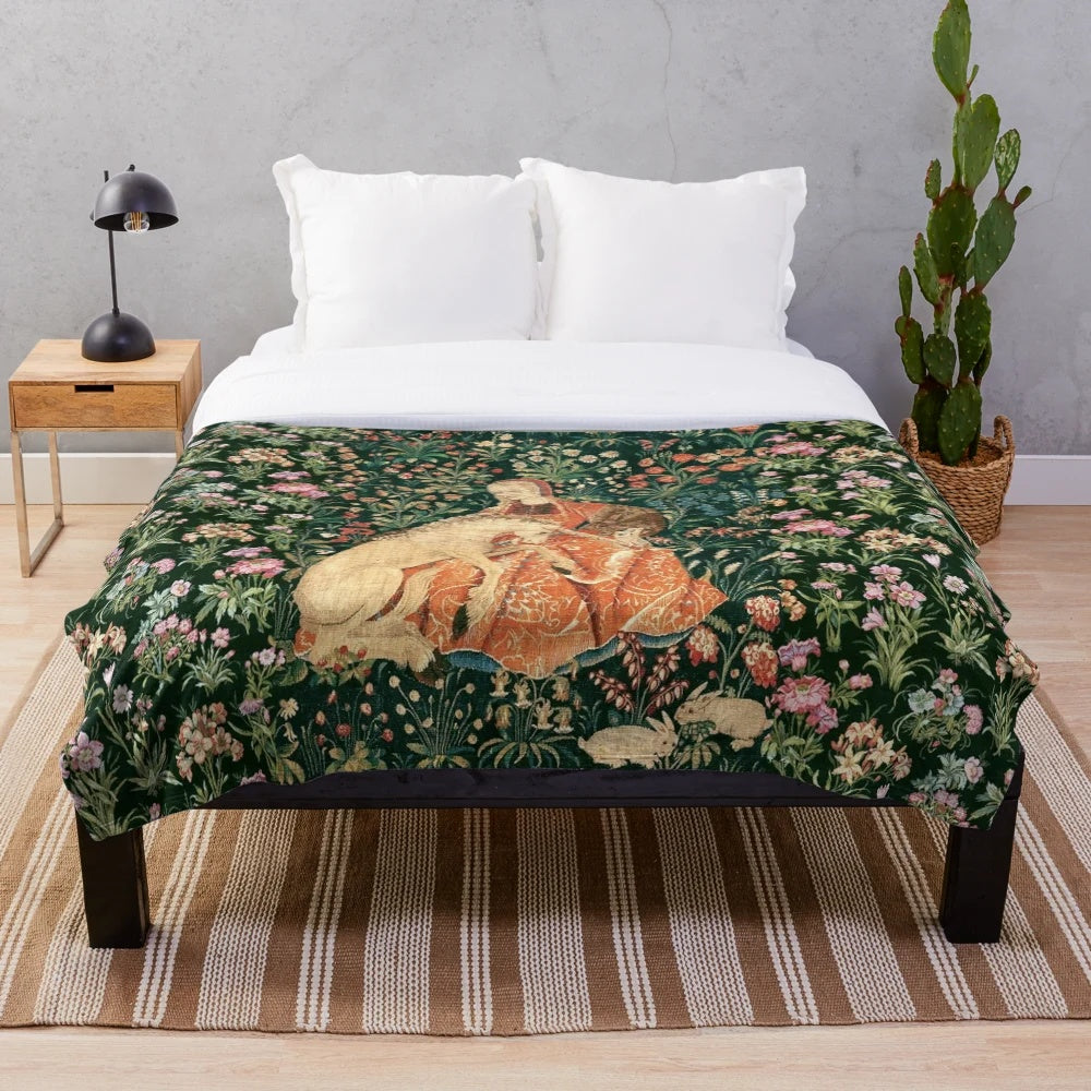 Fantasy unicorn and lady surrounded by floral and greenery on plush blanket