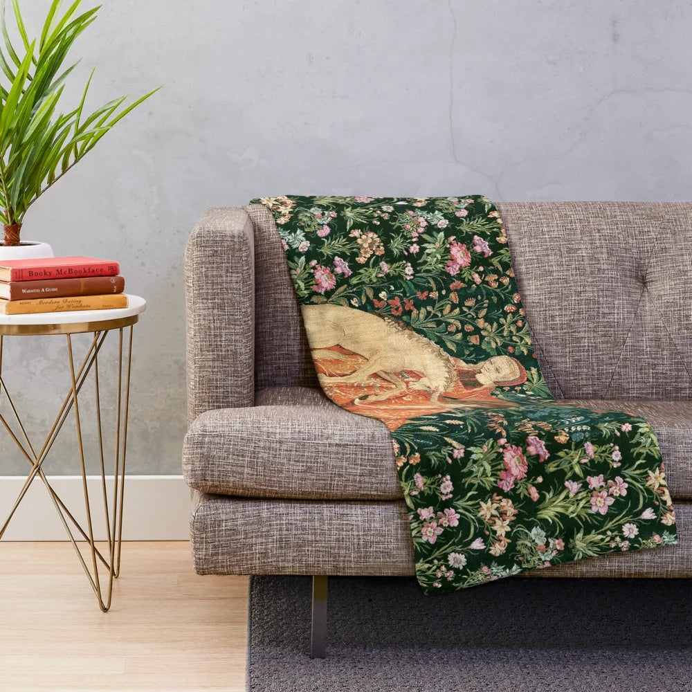 Fantasy unicorn and lady surrounded by floral and greenery on plush blanket