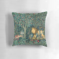 Lush green and blue floral tapestry pillow with forest animals including a lion and hares