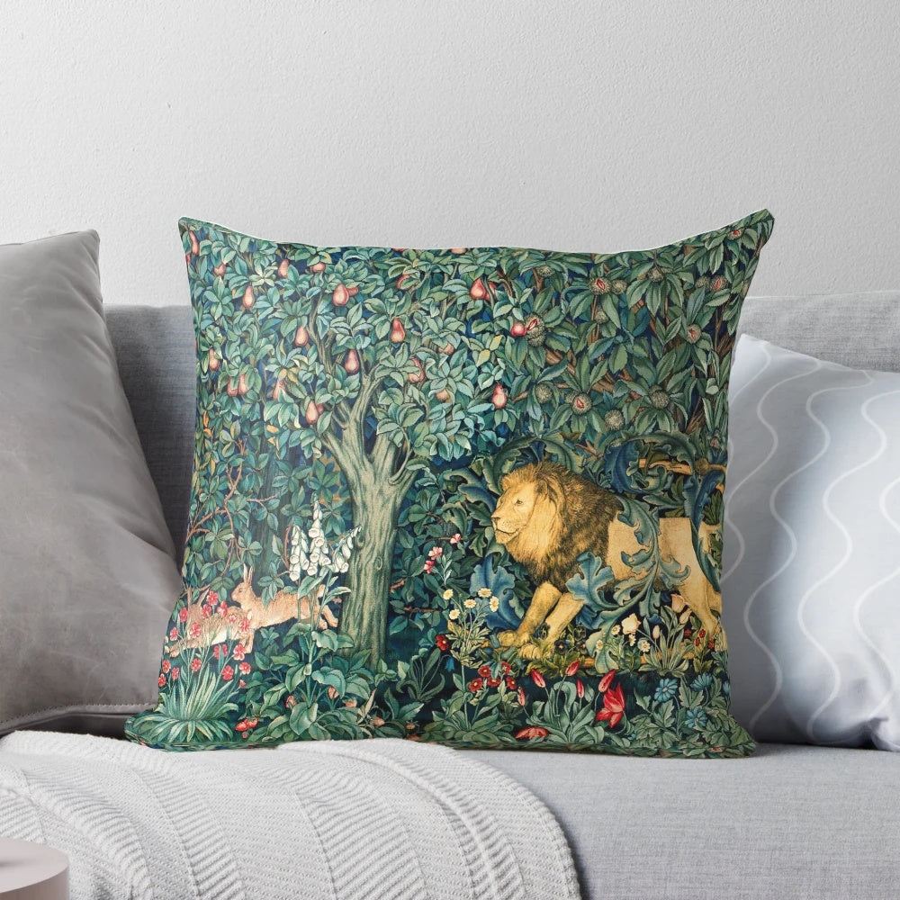 Lush green and blue floral tapestry pillow with forest animals including a lion and hares
