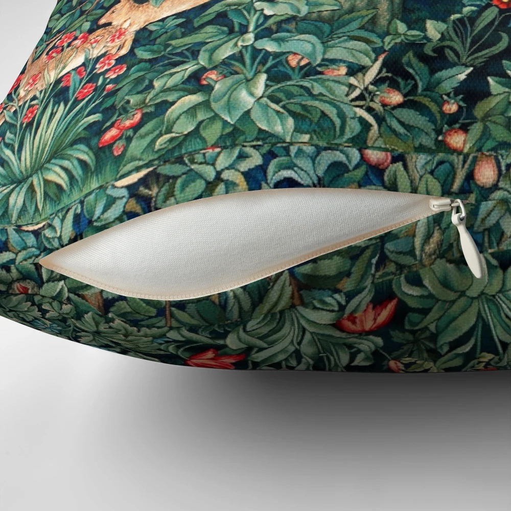 Lush green and blue floral tapestry pillow with forest animals including a lion and hares