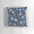 Decorative pillow featuring a whimsical pattern of forest animals like raccoons, owls, bunnies, and a chick in an autumnal woodland setting.
