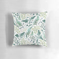 Vibrant green forest dragons printed on a white decorative pillow
