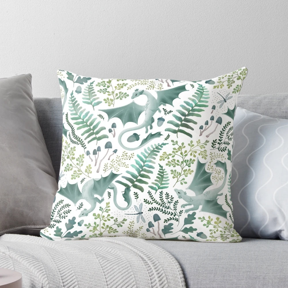 Vibrant green forest dragons printed on a white decorative pillow