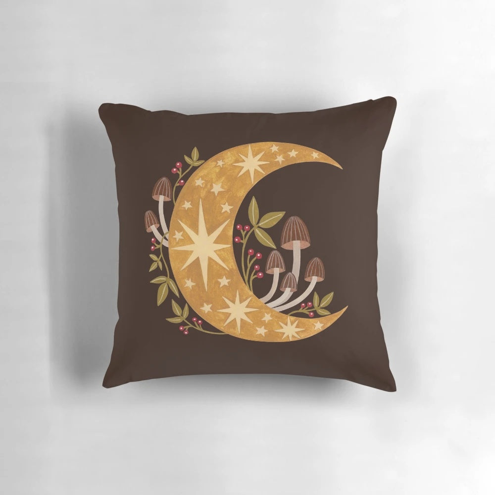 A cozy pillow featuring a mystical forest and glowing autumn moon design