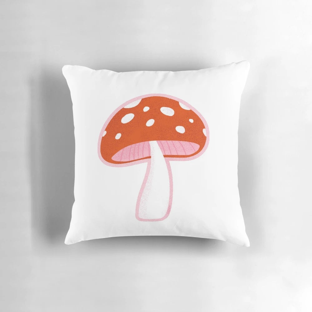 Forest mushroom pillow with vibrant red and pink tones, perfect for nature-inspired home decor.