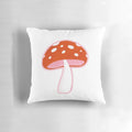 Forest mushroom pillow with vibrant red and pink tones, perfect for nature-inspired home decor.