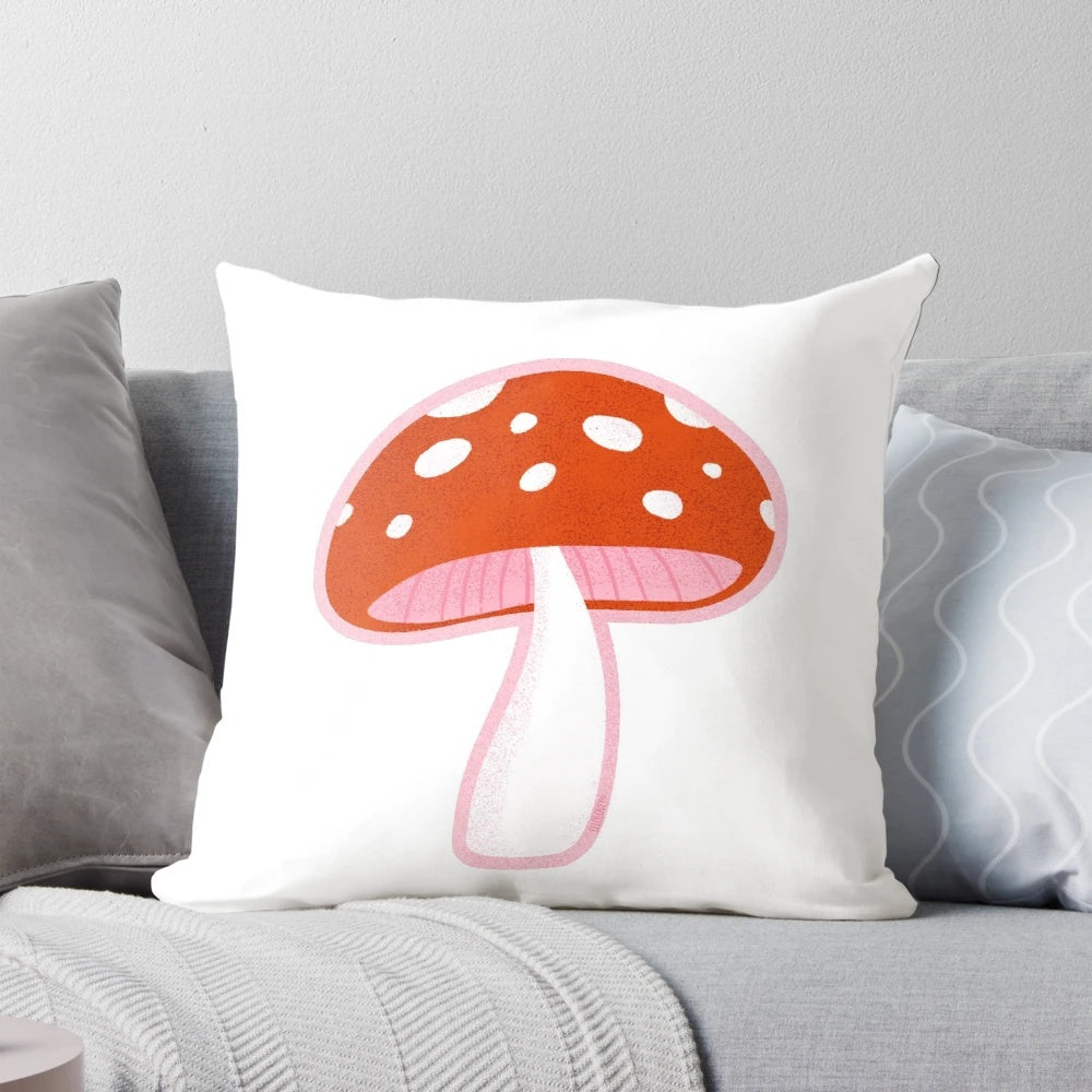 Forest mushroom pillow with vibrant red and pink tones, perfect for nature-inspired home decor.