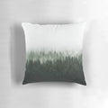 A cozy forest pillow featuring Cascadia trees covered in magical light and misty fog, creating a fairytale-like wilderness scene.