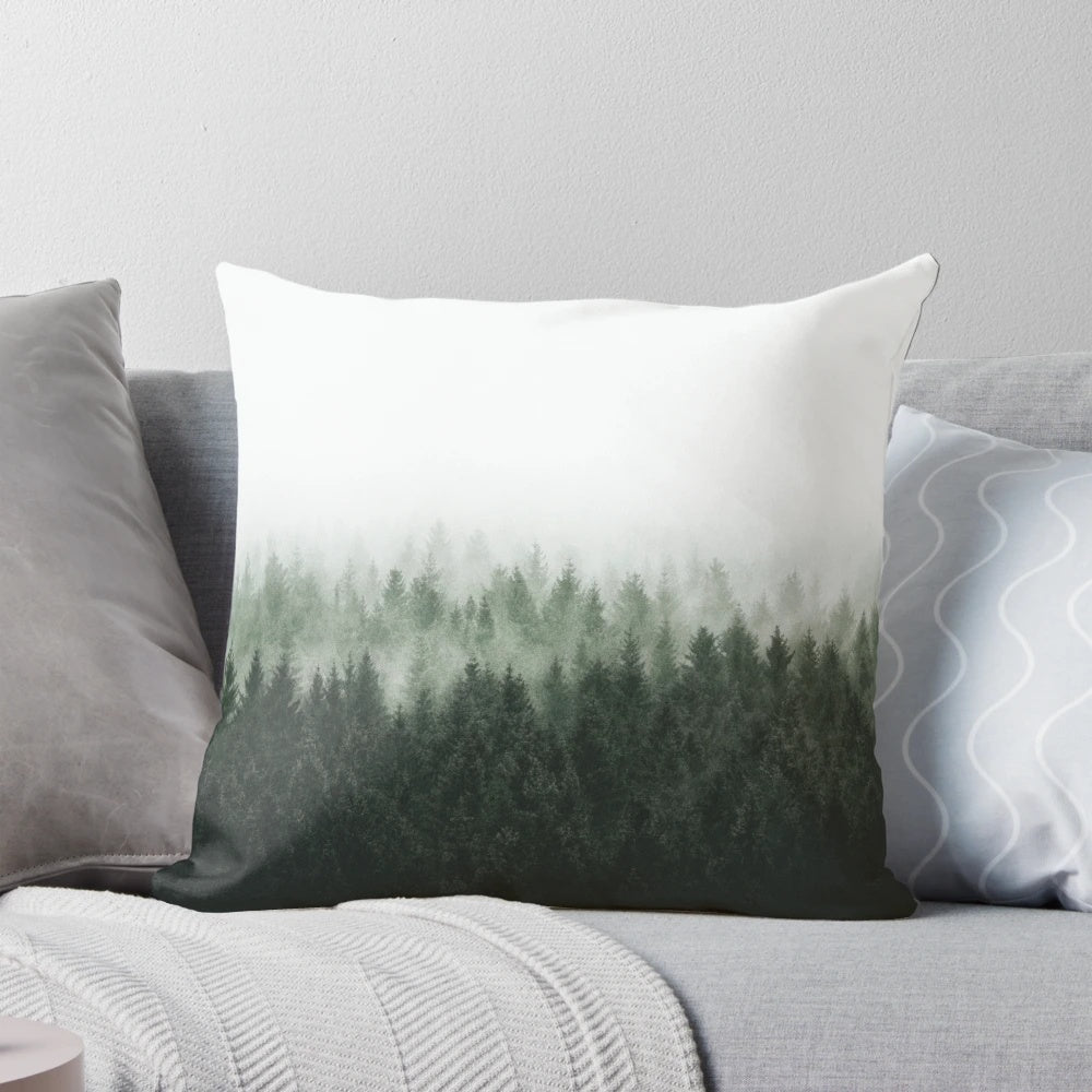 A cozy forest pillow featuring Cascadia trees covered in magical light and misty fog, creating a fairytale-like wilderness scene.