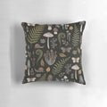A decorative pillow featuring a whimsical pattern of forest elements like mushrooms, ferns, and moss, creating a captivating botanical and natural aesthetic.