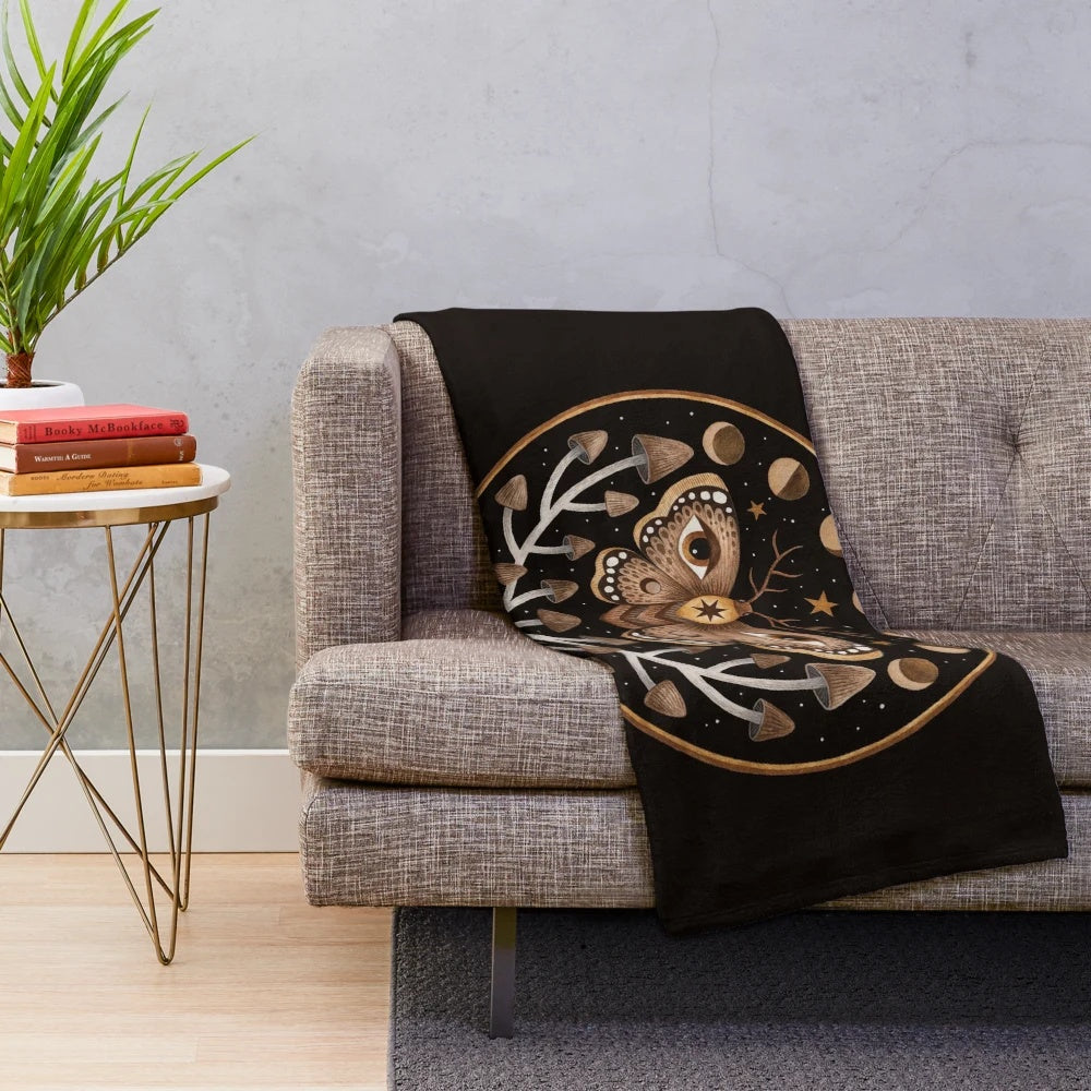 Plush blanket featuring forest, mushrooms, moth, and lunar imagery