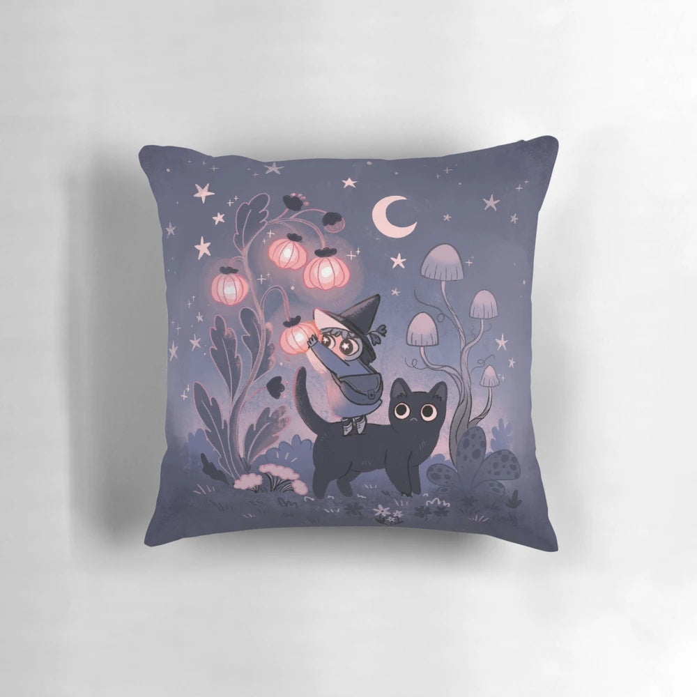 Decorative throw pillow featuring a mystical garden scene with a black cat, mushrooms, moon and stars in shades of purple.