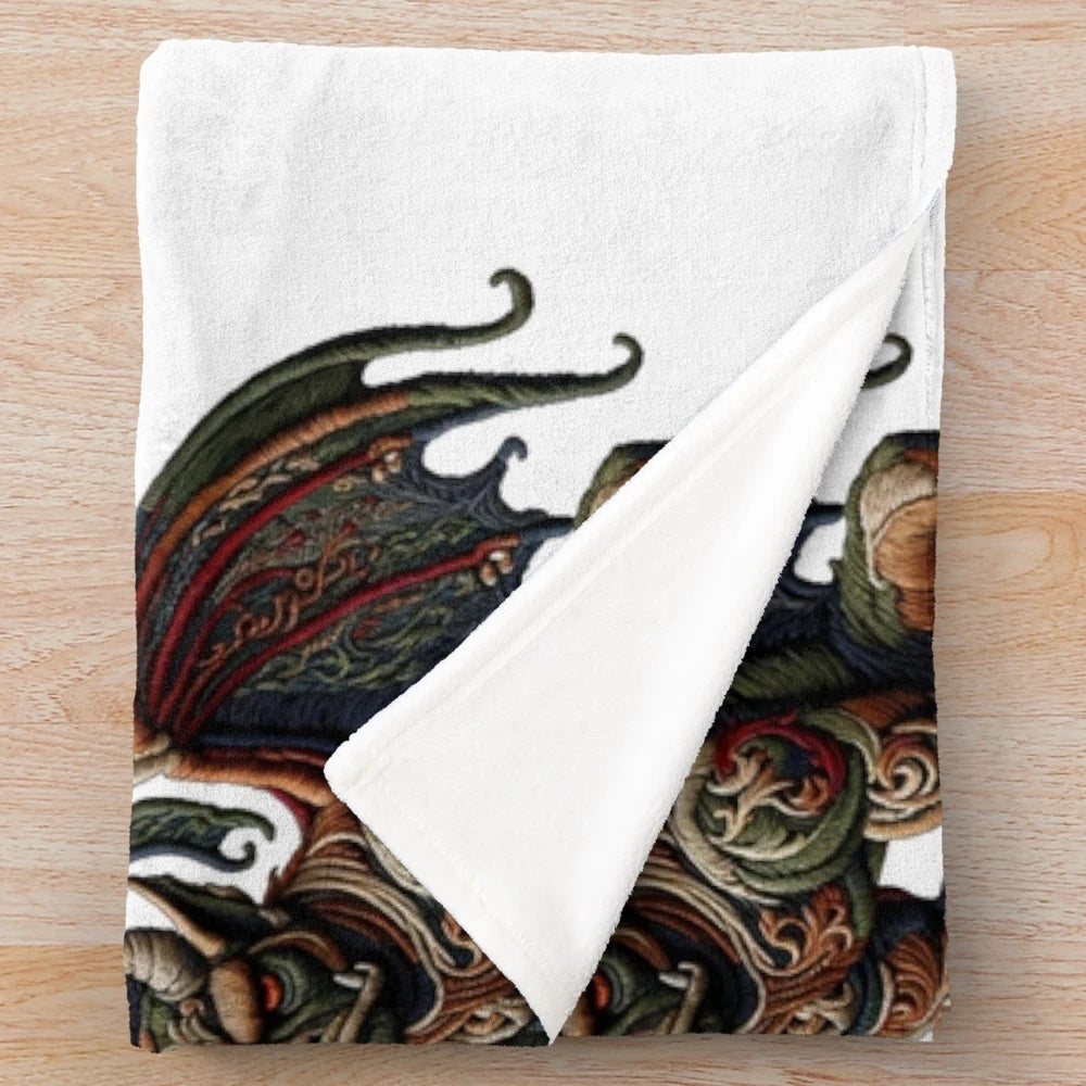 Gargoyle plush blanket with embroidered mythical creature design