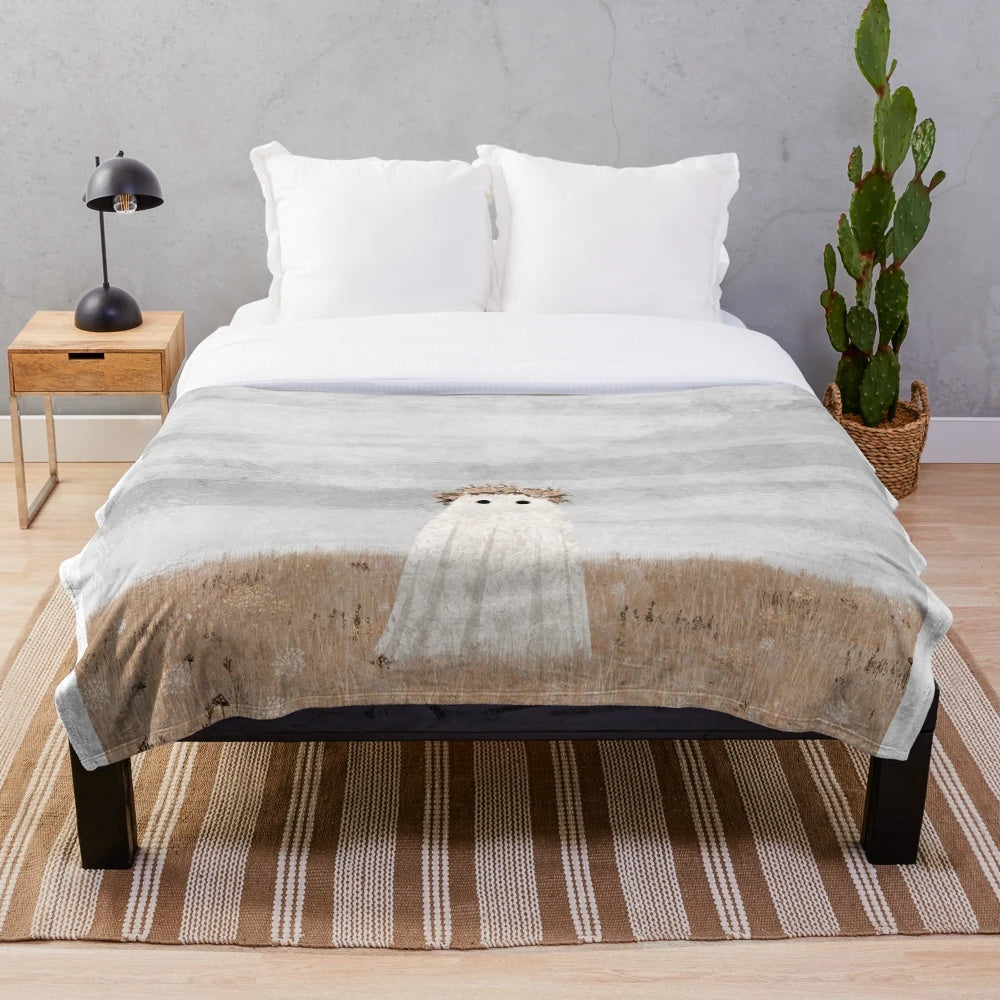 Soft and cozy plush blanket featuring a ghostly meadow scene with wildflowers
