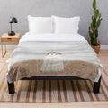 Soft and cozy plush blanket featuring a ghostly meadow scene with wildflowers