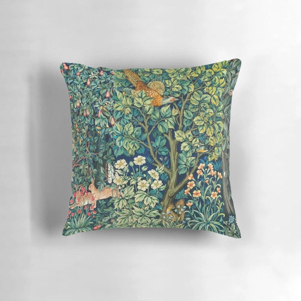 Green floral tapestry pillow with pheasant, squirrel, and hares on a nature-inspired design