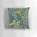 Green floral tapestry pillow with pheasant, squirrel, and hares on a nature-inspired design