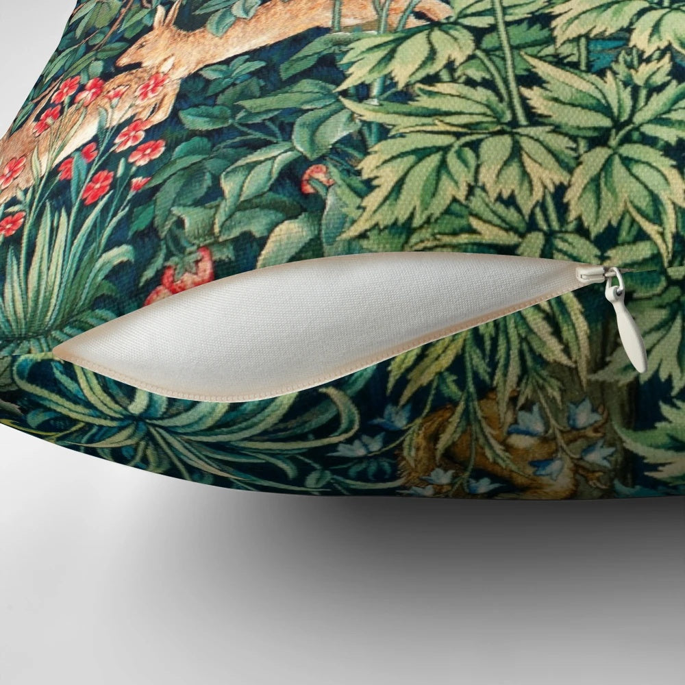 Green floral tapestry pillow with pheasant, squirrel, and hares on a nature-inspired design