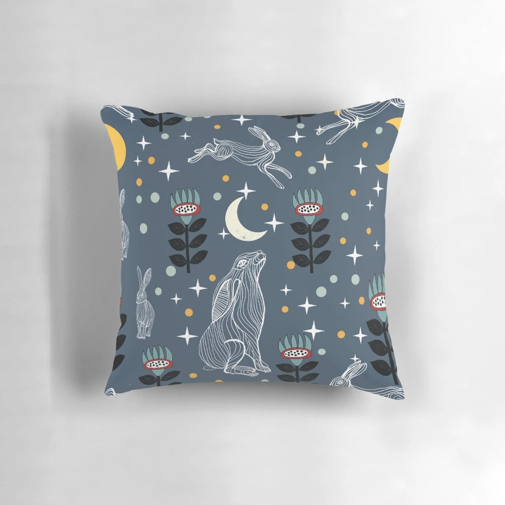 A soft, plush pillow featuring a whimsical hare silhouetted against a glowing moon, perfect for creating a serene, nature-inspired ambiance.
