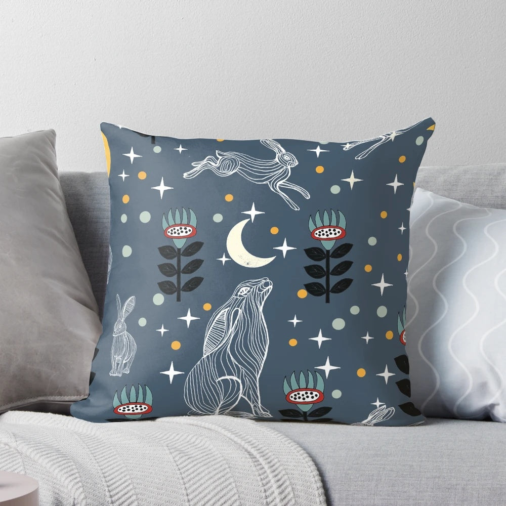 A soft, plush pillow featuring a whimsical hare silhouetted against a glowing moon, perfect for creating a serene, nature-inspired ambiance.