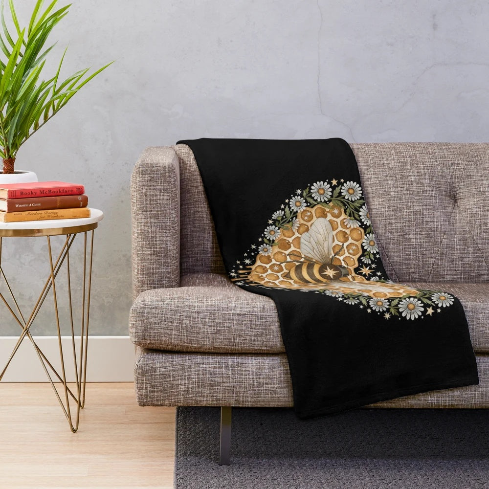 Soft, heart-shaped plush blanket with nature-inspired floral and honeycomb design