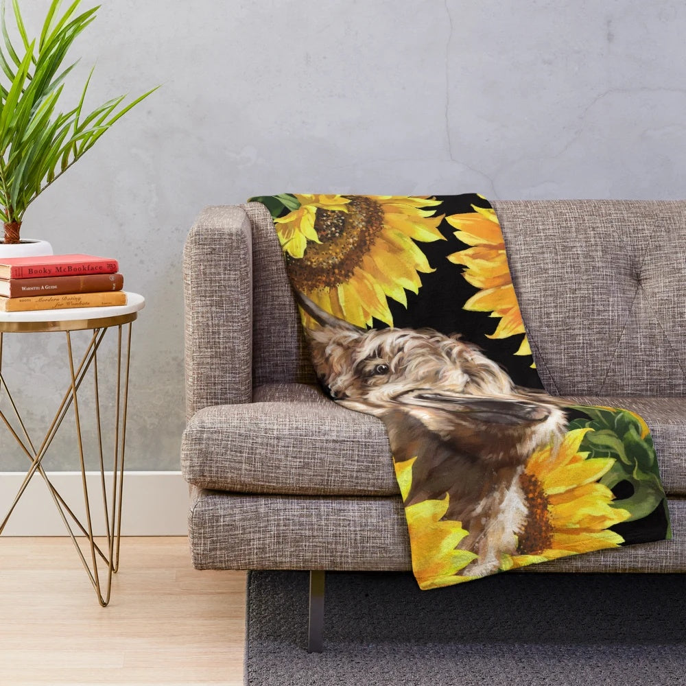 Cozy plush blanket featuring a highland cow in a sunflower garden