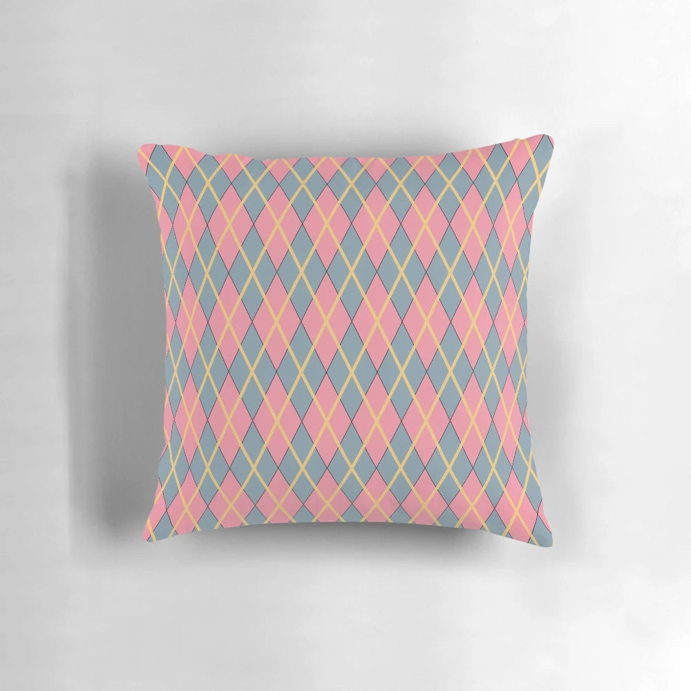 Howl's Moving Castle-inspired argyle pillow with pink, gray, and goldenrod diamond pattern
