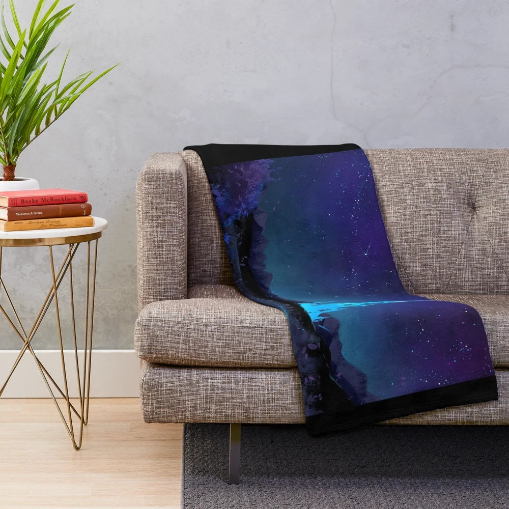 Lakeland-inspired plush blanket with a starry night sky and fantasy landscape design