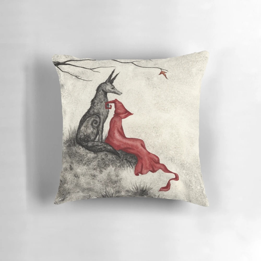 Whimsical fantasy pillow featuring a red-cloaked figure and forest animals in an enchanted autumn setting