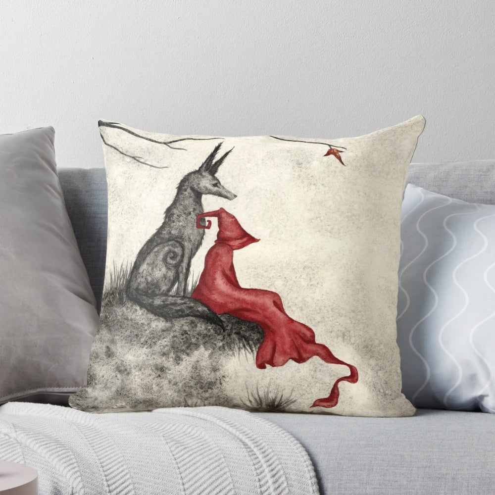 Whimsical fantasy pillow featuring a red-cloaked figure and forest animals in an enchanted autumn setting