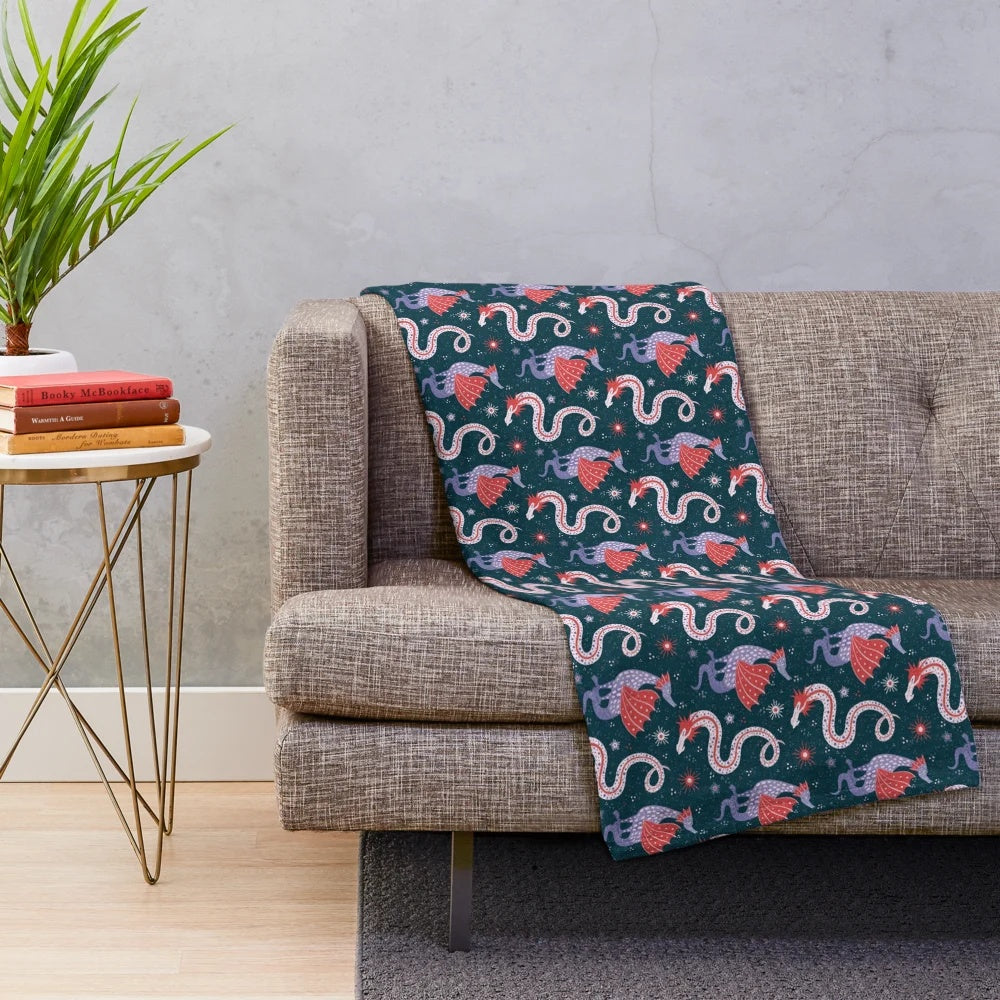 Plush blanket featuring hand-drawn illustrations of legendary dragons