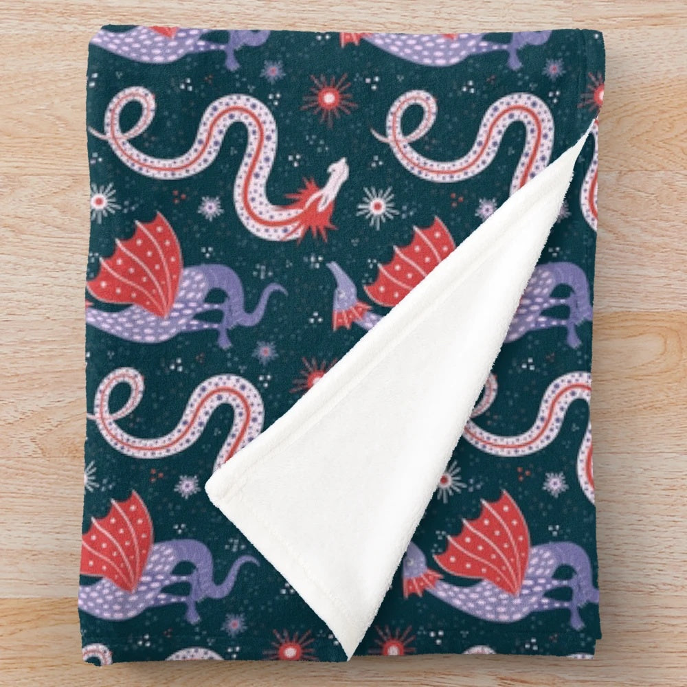 Plush blanket featuring hand-drawn illustrations of legendary dragons
