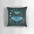 Pillow featuring illustrations of the luna moth and emerald moth in a moonlit garden
