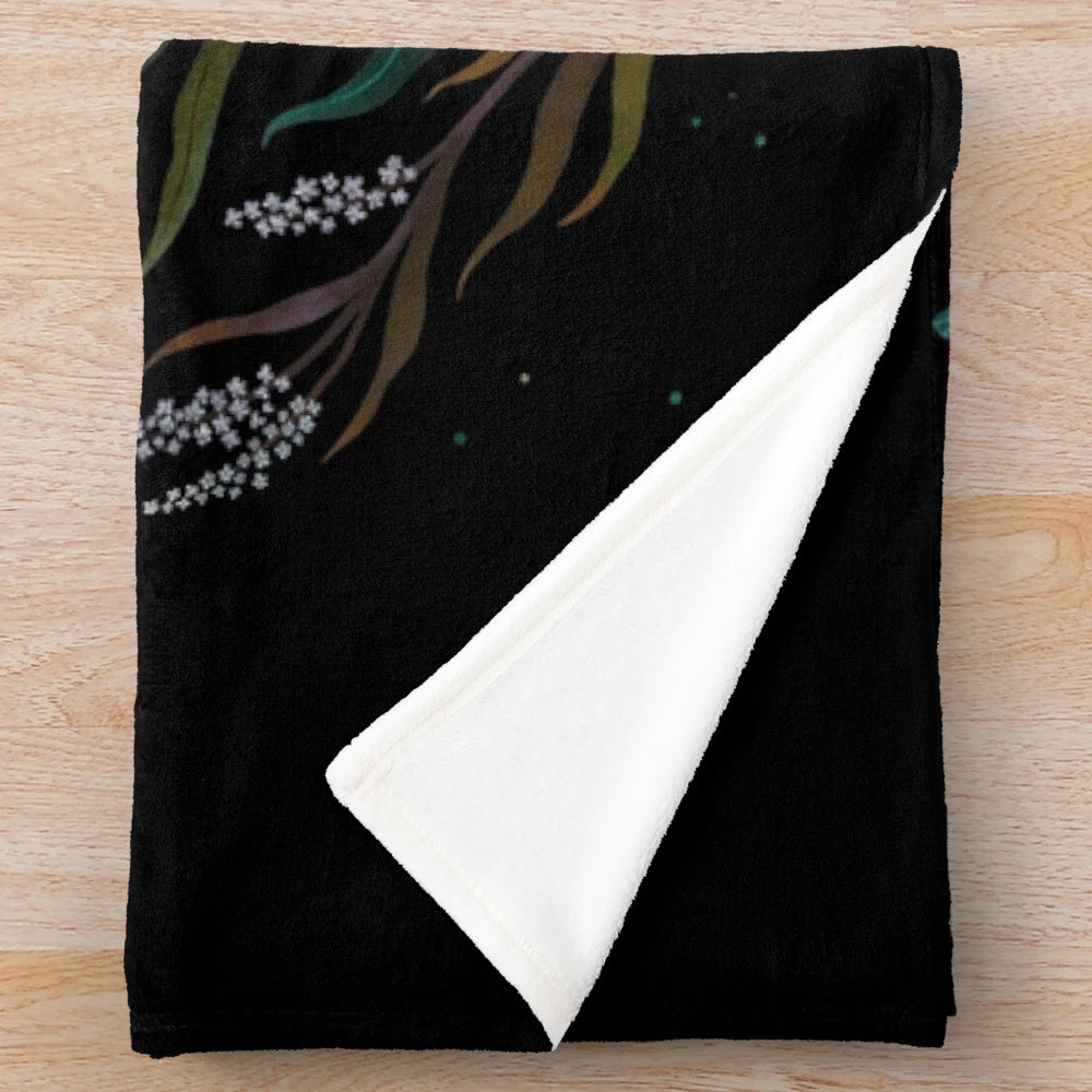 Luna and Forester Plush Blanket featuring a botanical and lunar design