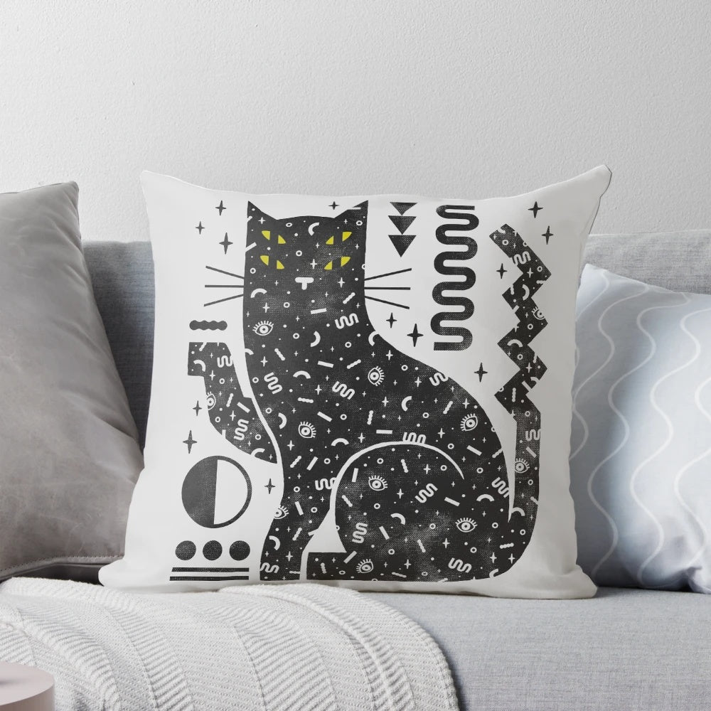 A cozy black cat pillow with a mystical, witchy design for Halloween home decor.