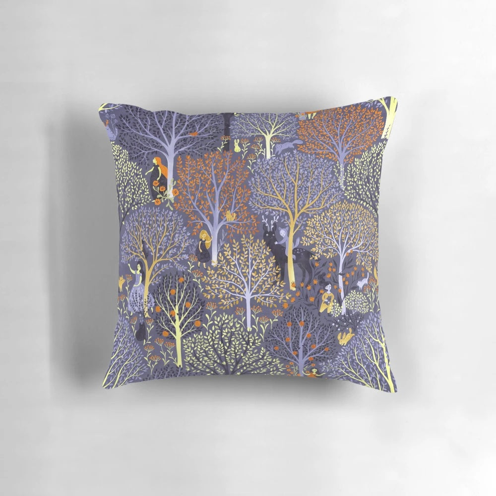 Vibrant blue pillow with a magical forest design, featuring trees, fairies, and other enchanting elements.