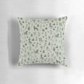A whimsical medieval-inspired throw pillow featuring a colorful floral and foliage pattern with magical creatures.
